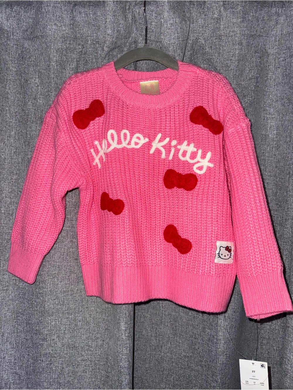 Sanrio Hello Kitty Pink Sweater with Red Bow Accents